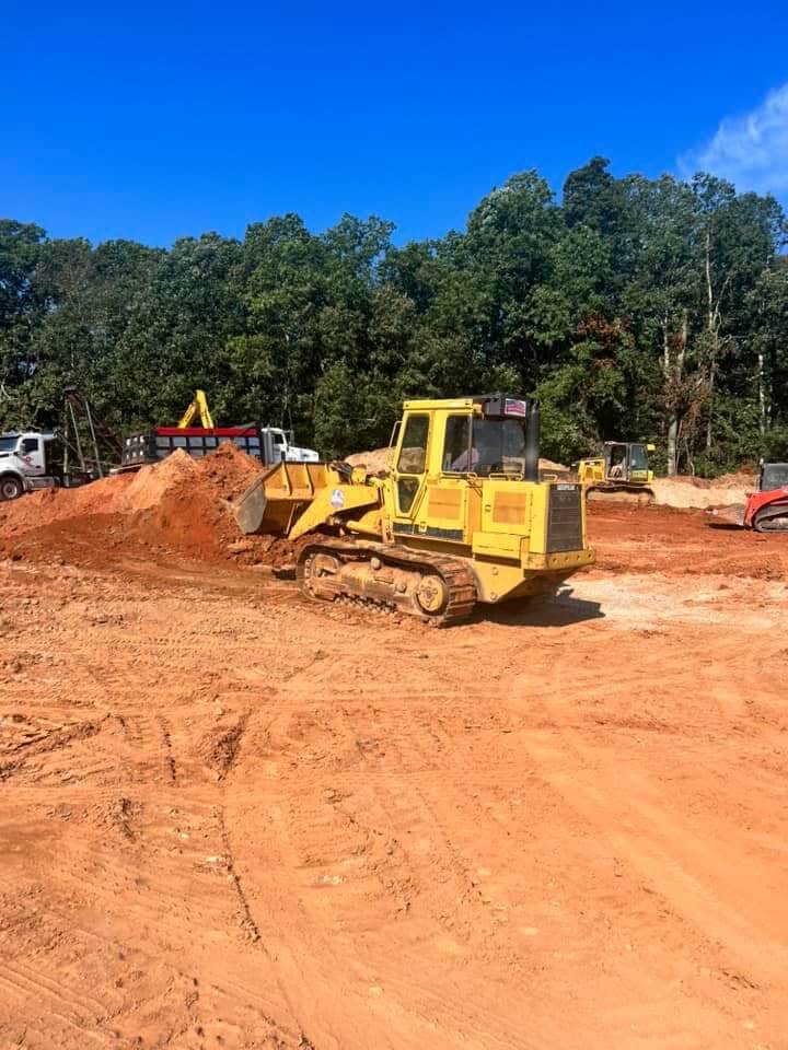 Bulldozer performing land grading and site preparation for construction in Dawson County, Georgia