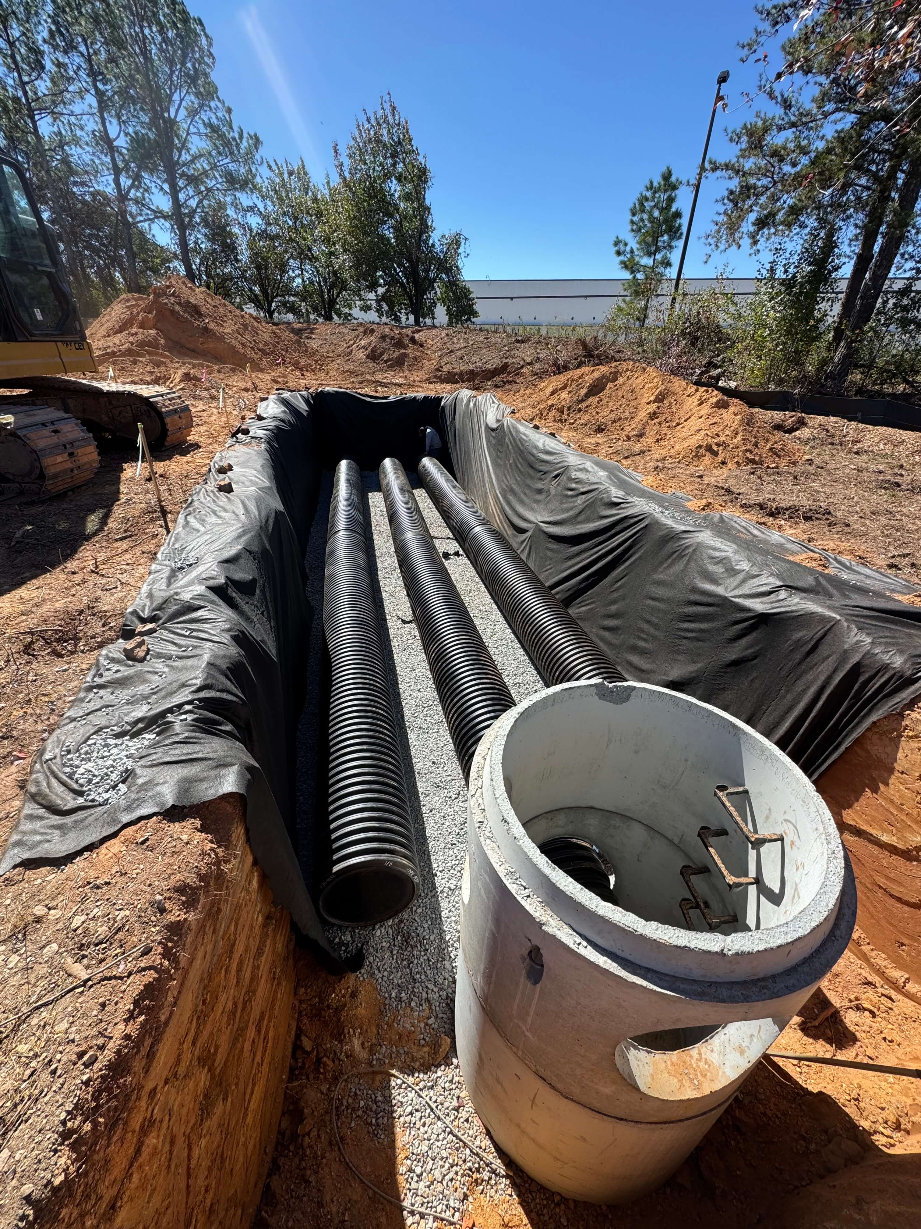 Stormwater drainage pipe system installation for land disturbance project in Forsyth County, Georgia