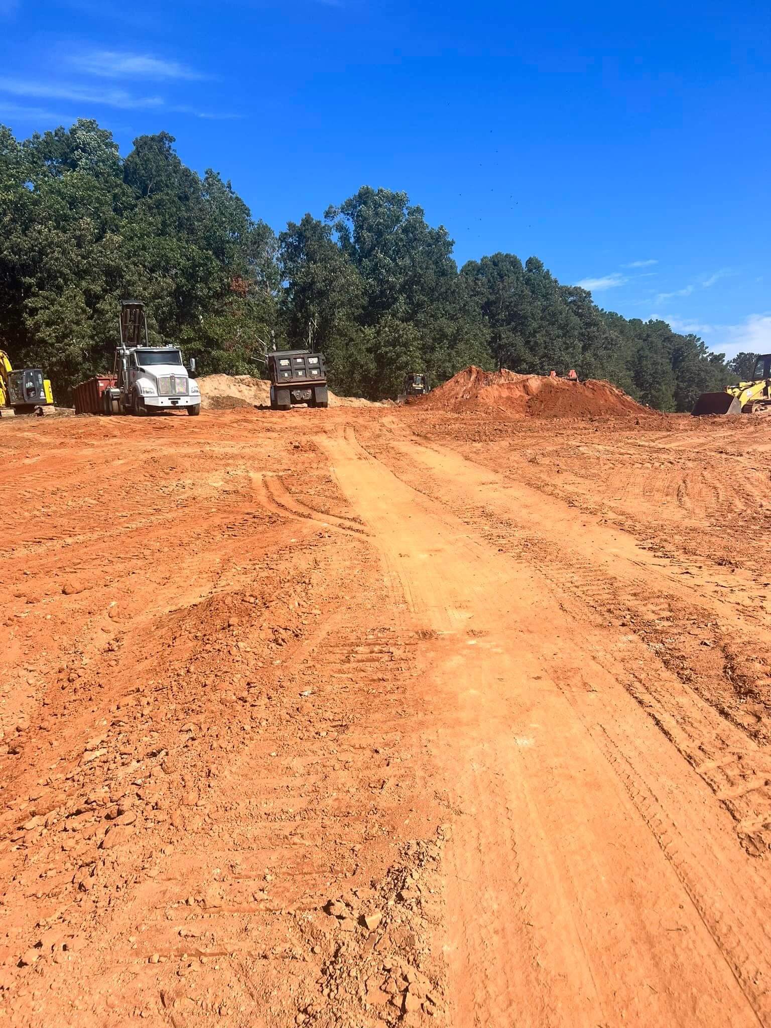 Dump truck hauling fill dirt for grading and excavation project in Gainesville, Hall County, Georgia