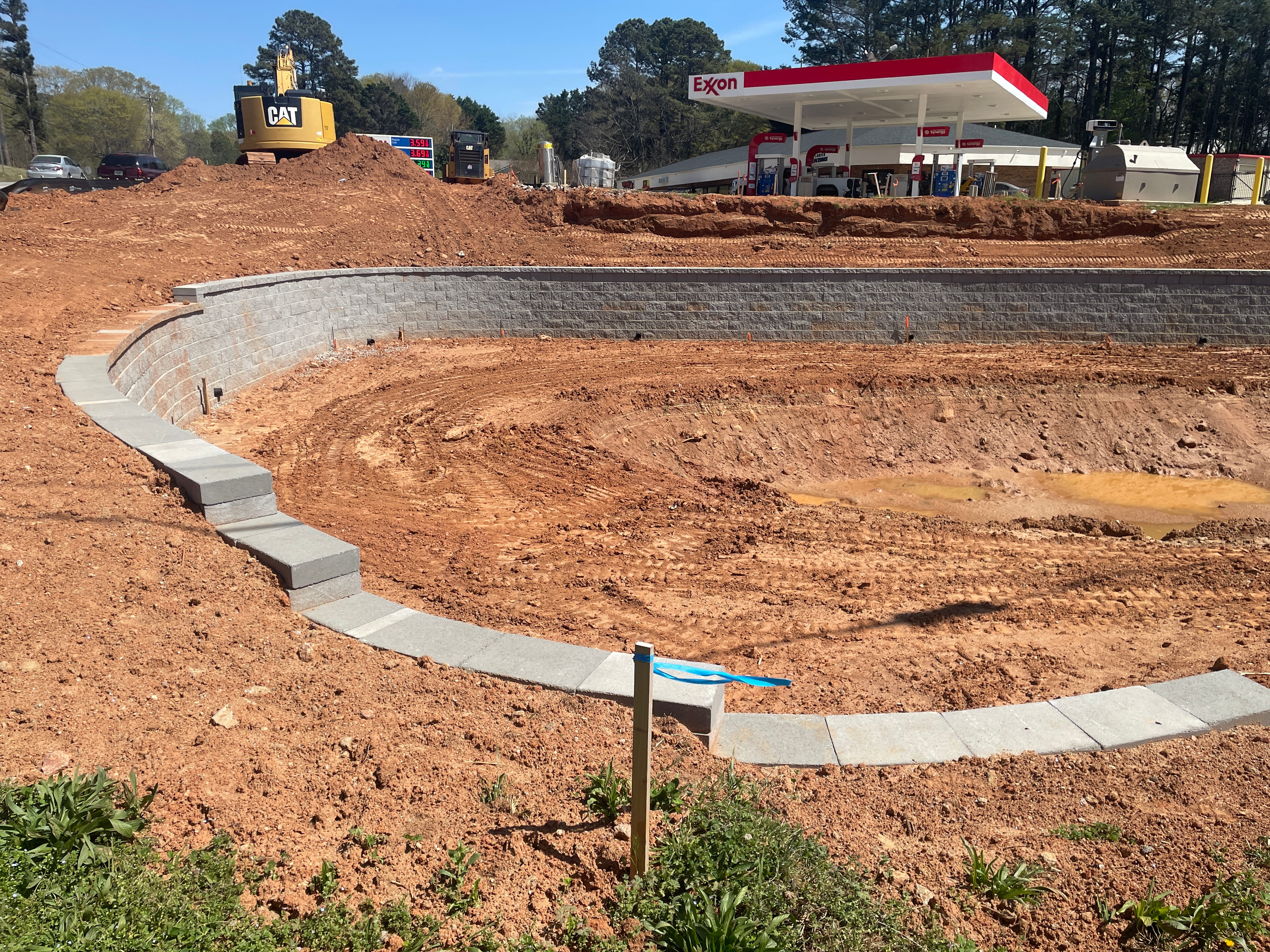 Commercial storm pond grading and site clearing for construction development in Northeast Georgia