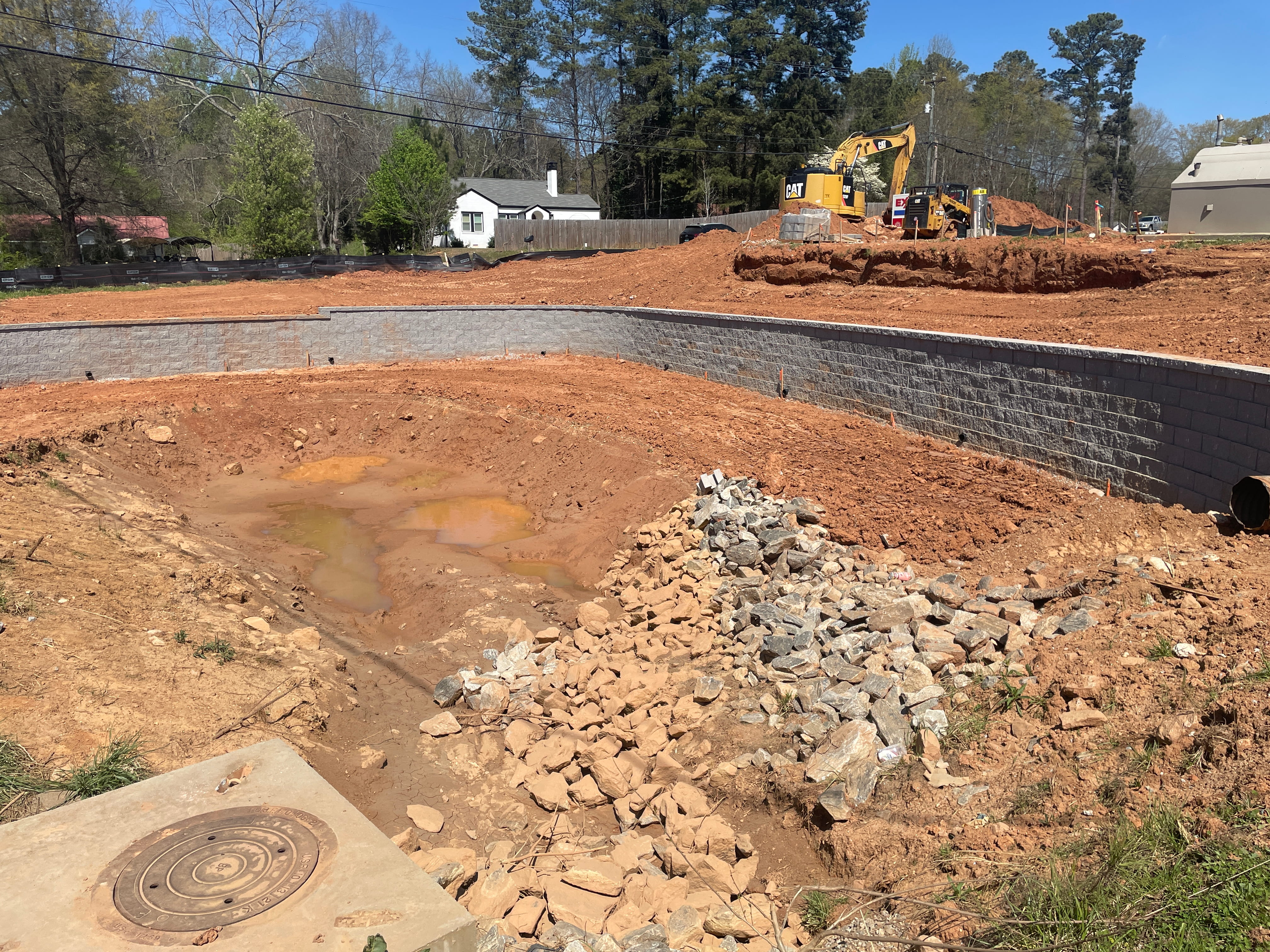 Storm pond retaining wall and grading for site development in Dawson County, Northeast Georgia