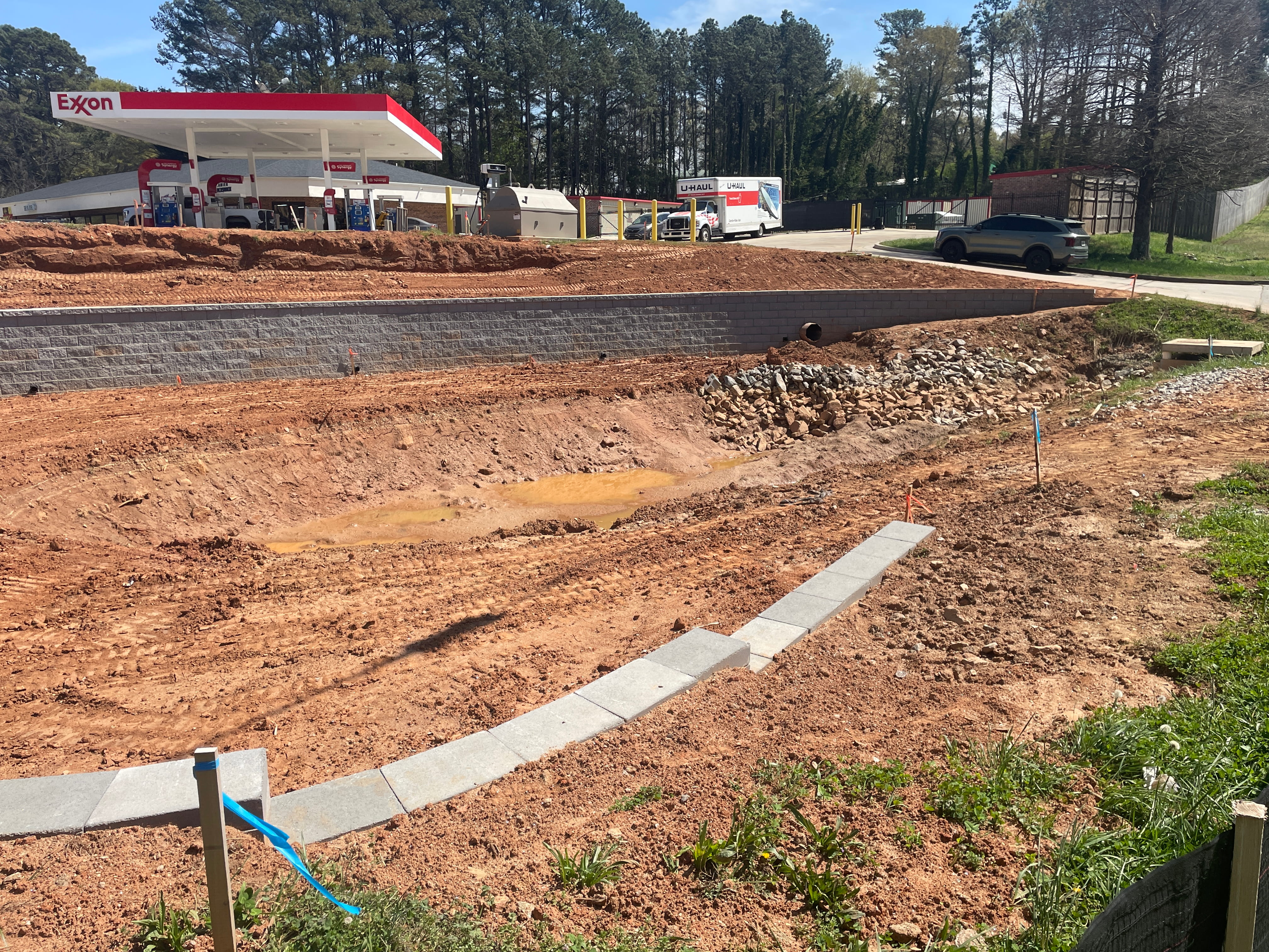Completed stormwater pond with erosion control and final grading in Northeast Georgia