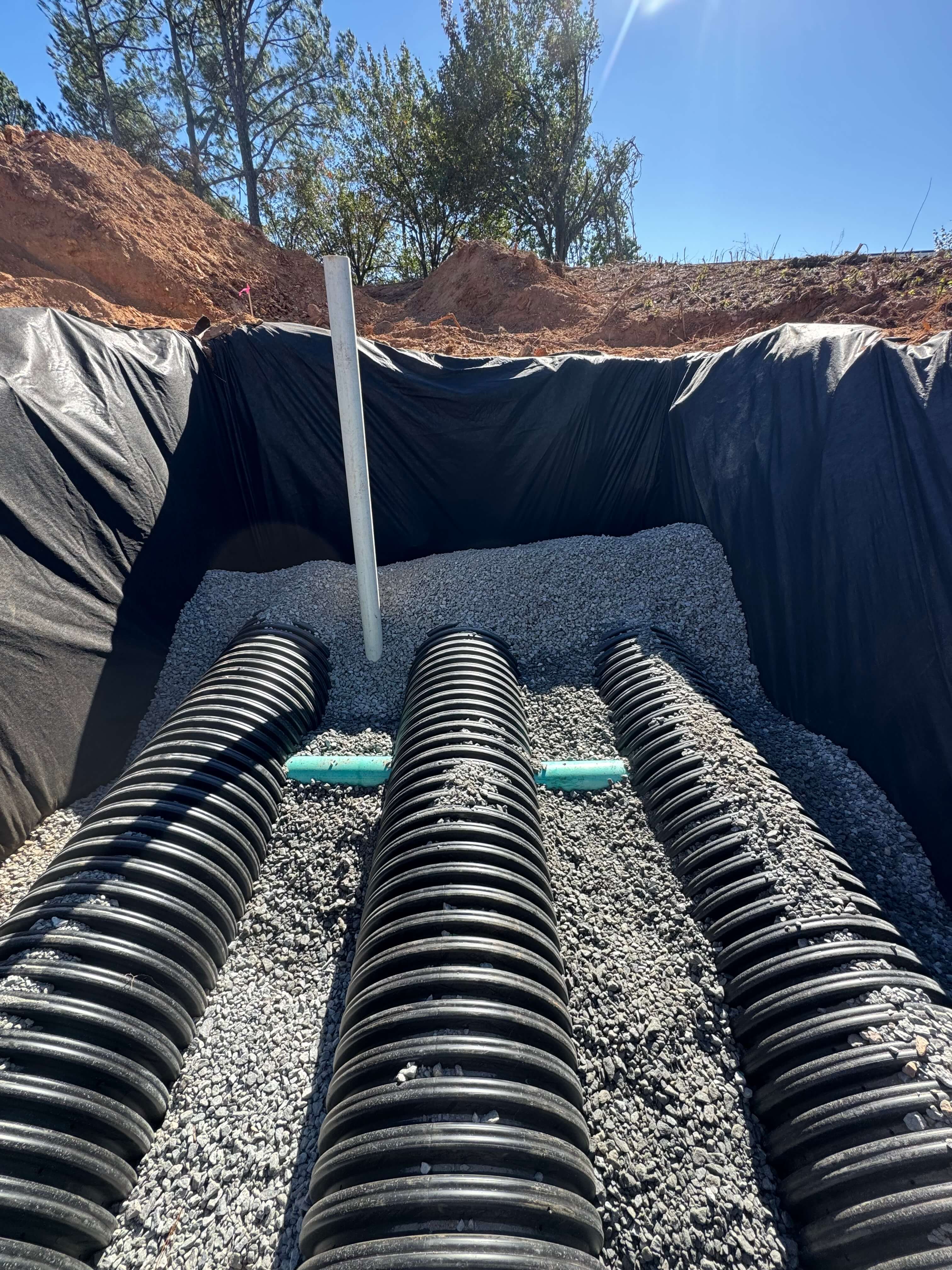 Stormwater drain pipe installation for civil site work and land disturbance in Dawsonville, Dawson County, Georgia